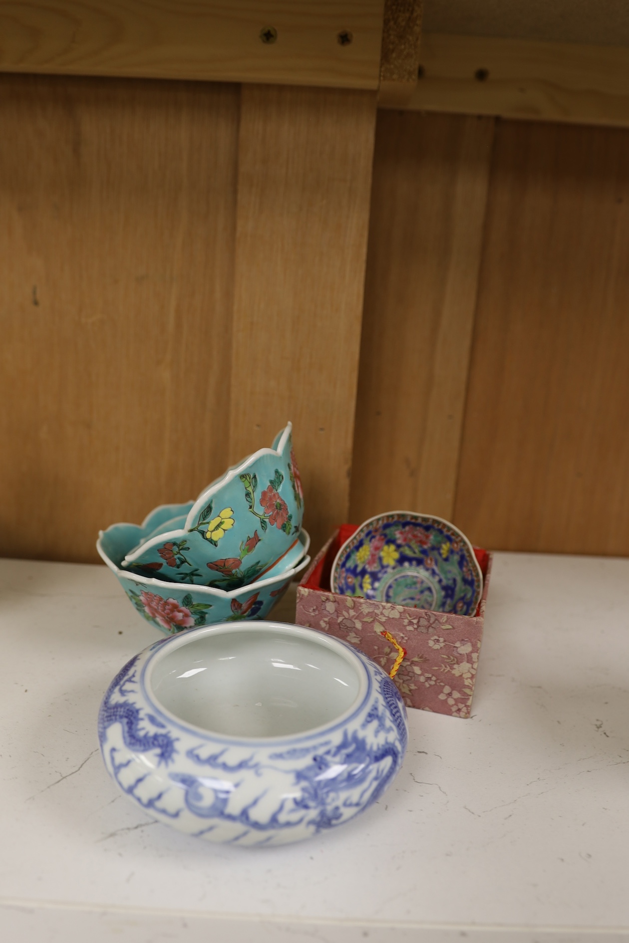 A pair of Chinese enamelled porcelain bowls, an eggshell bowl and a blue and white dragon bowl, turquoise bowls 11cm diameter (4). Condition - fair